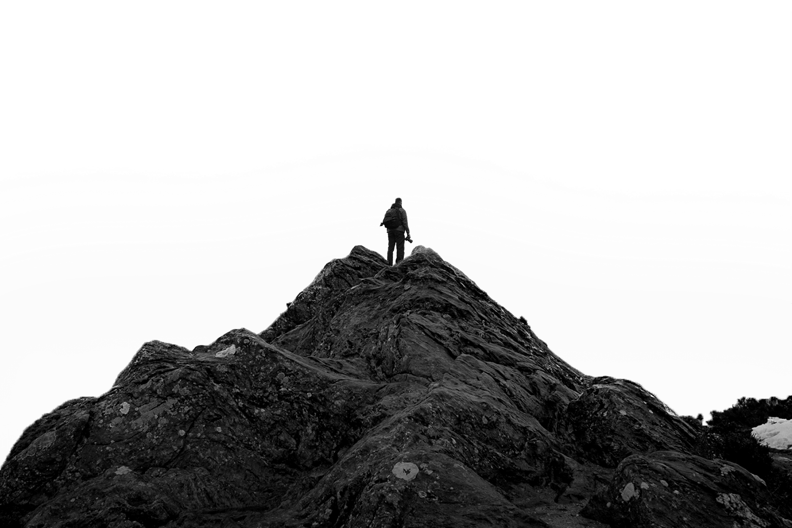 Photographer on top of a Scottish mountain